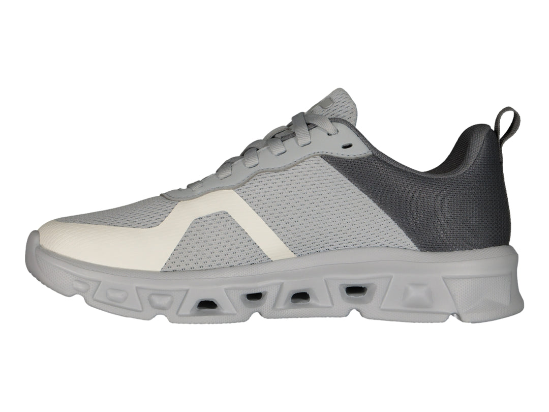 Tenis deportivos Charly color gris con detalles en blanco y suela gruesa.