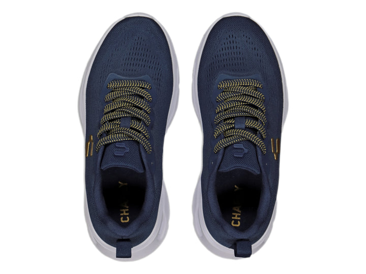 Tenis deportivos Charly color marino con suela blanca y detalles dorados.