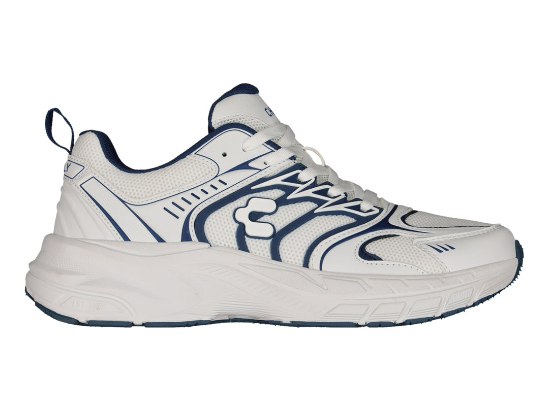 Tenis Charly Fashion Sport color blanco con detalles decorativos en azul marino y suela gruesa.