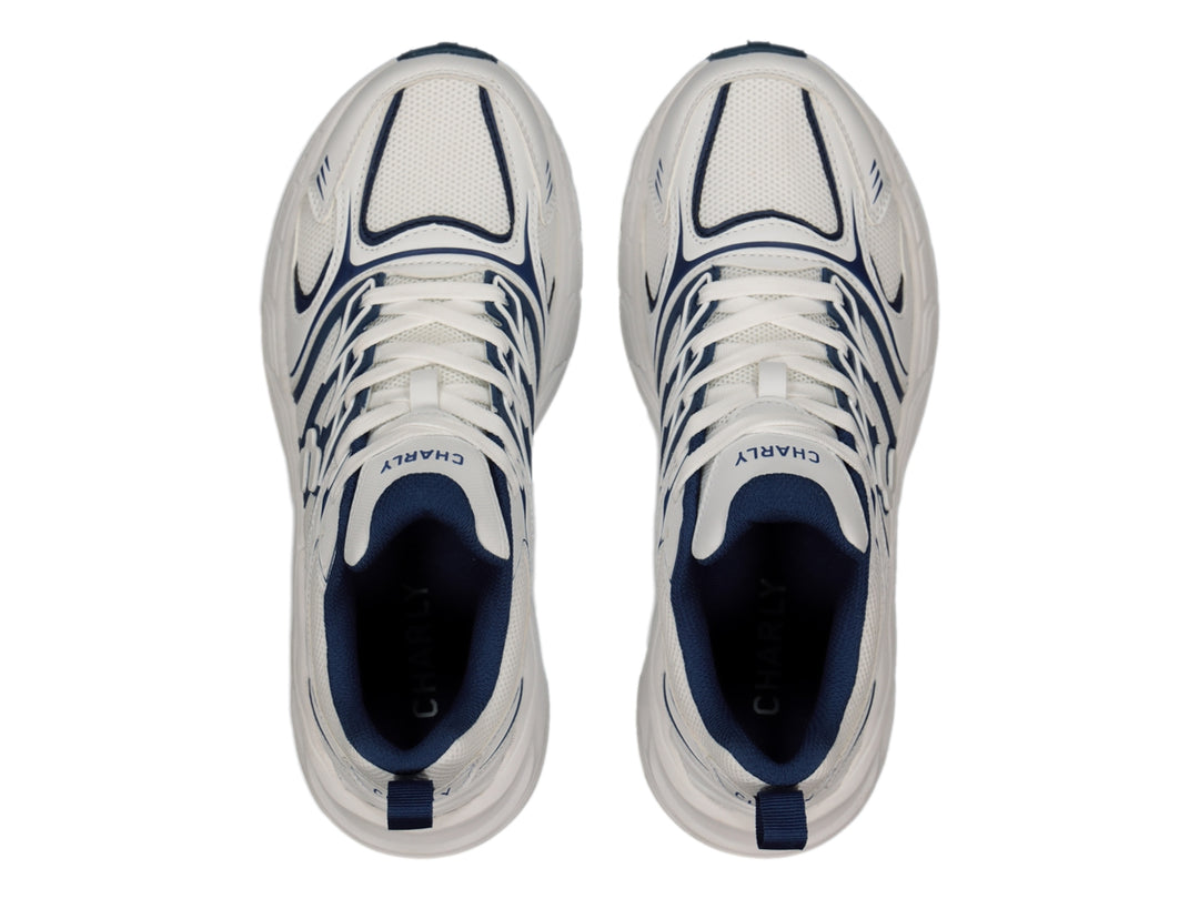 Tenis Charly Fashion Sport color blanco con detalles decorativos en azul marino y suela gruesa.