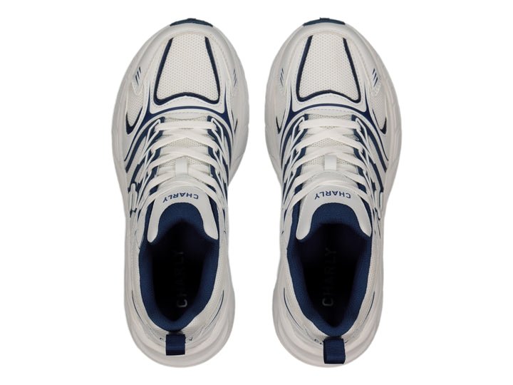 Tenis Charly Fashion Sport color blanco con detalles decorativos en azul marino y suela gruesa.