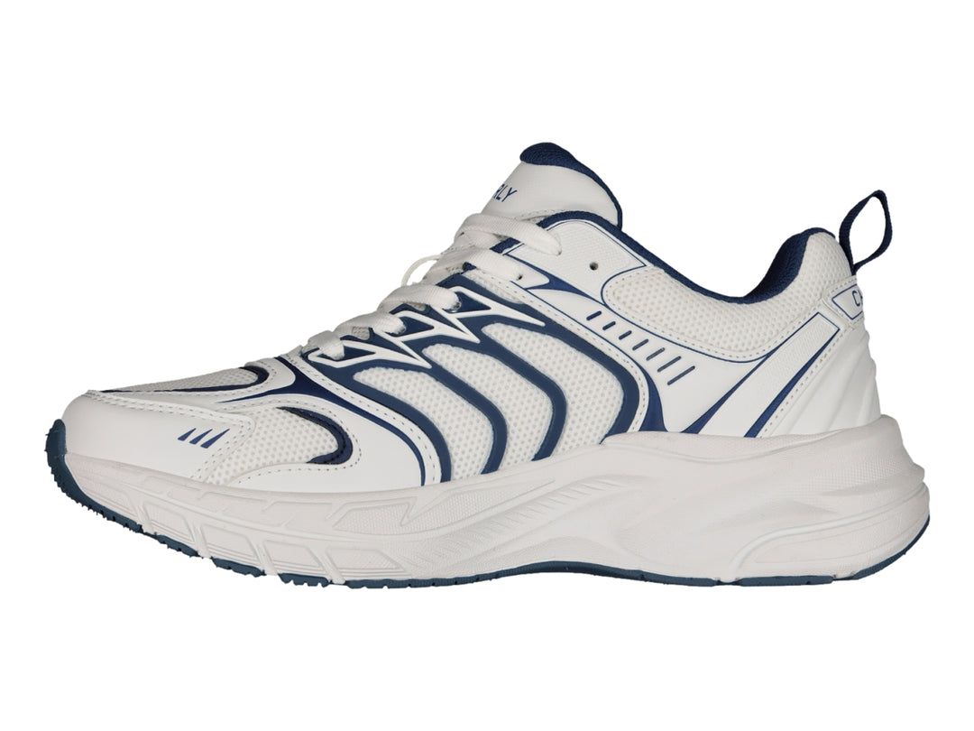 Tenis Charly Fashion Sport color blanco con detalles decorativos en azul marino y suela gruesa.