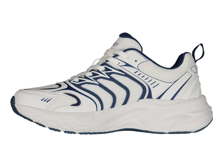 Tenis Charly Fashion Sport color blanco con detalles decorativos en azul marino y suela gruesa.