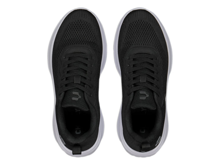 Tenis Charly Road Casual color negro con suela blanca y tejido de malla.