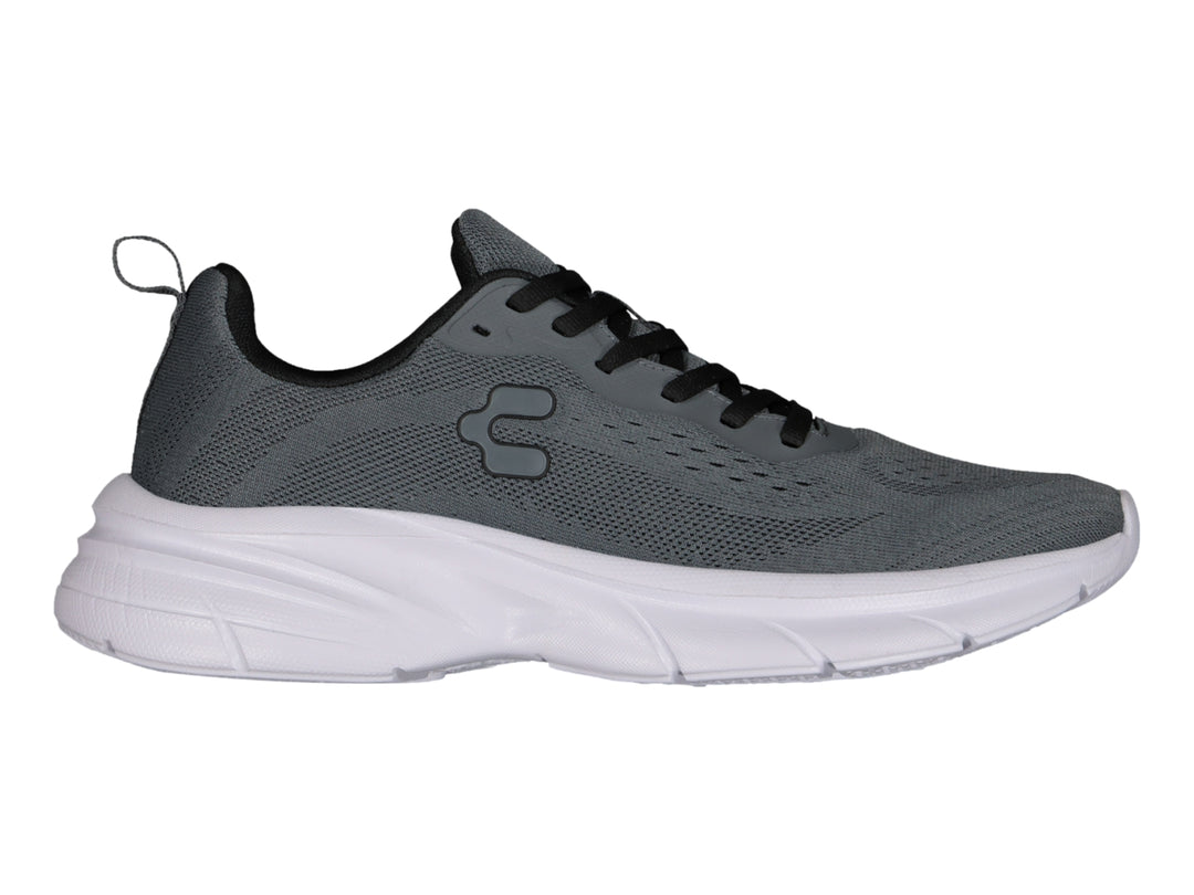 Tenis deportivos Charly color gris oxford con suela blanca y cordones negros.