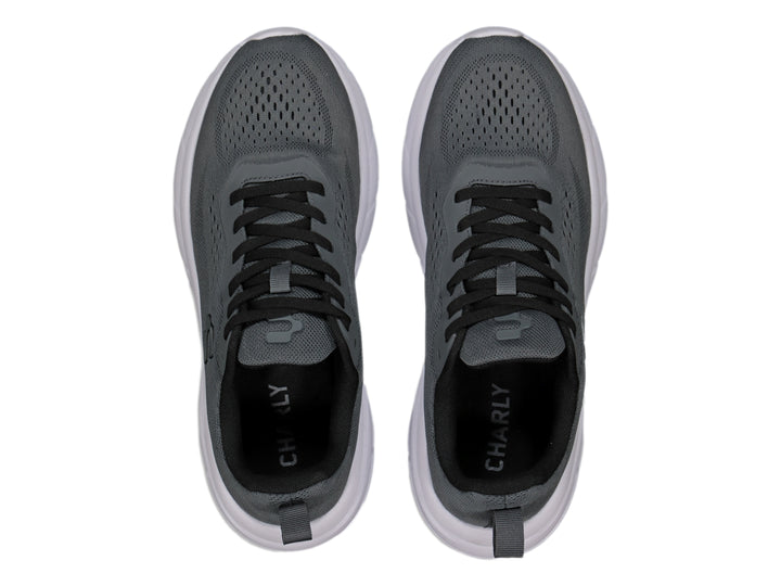 Tenis deportivos Charly color gris oxford con suela blanca y cordones negros.
