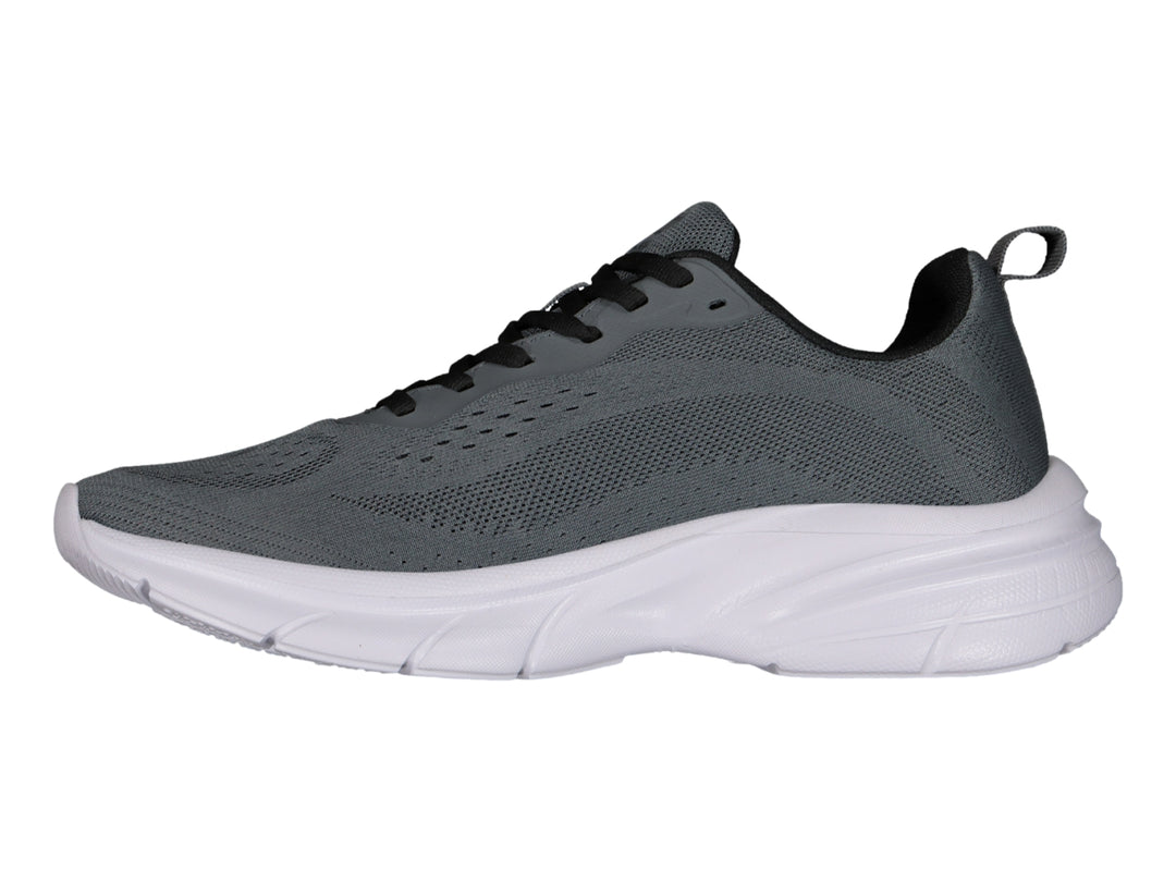 Tenis deportivos Charly color gris oxford con suela blanca y cordones negros.