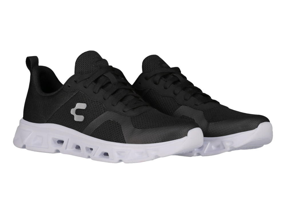 Tenis deportivos Charly color negro con suela blanca y tejido de malla.