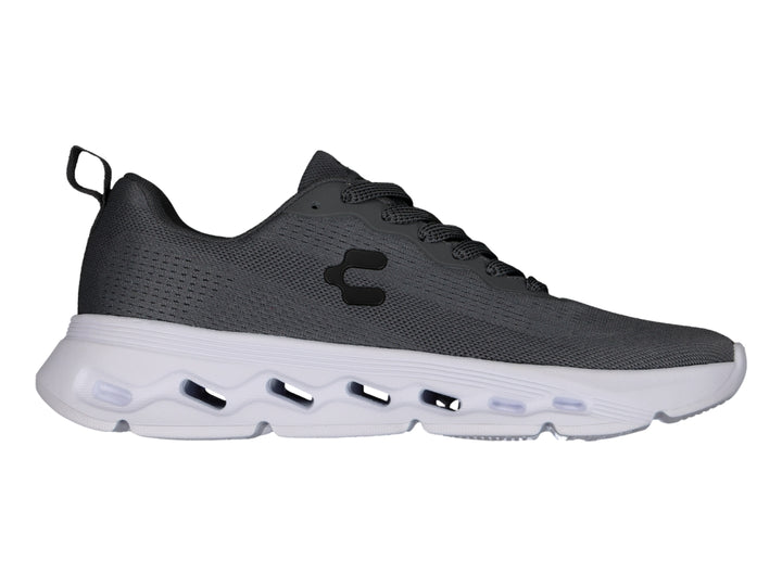 Tenis deportivos Charly color gris oxford con suela blanca y tejido de malla transpirable.