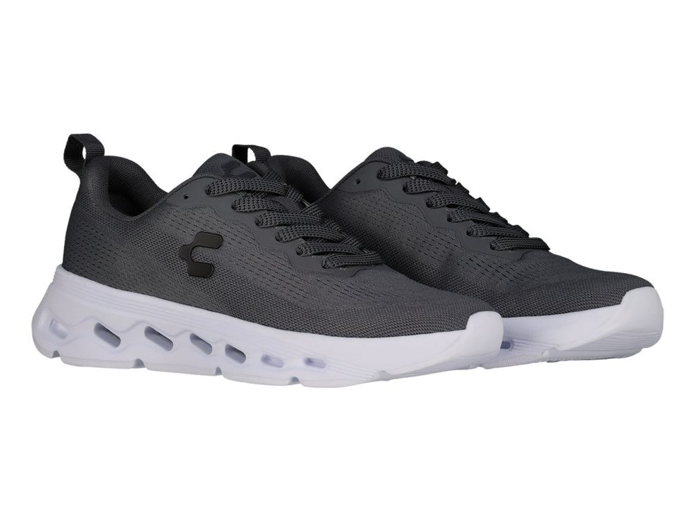 Tenis deportivos Charly color gris oxford con suela blanca y tejido de malla transpirable.