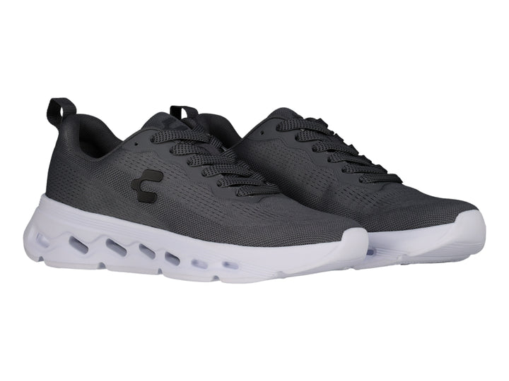 Tenis deportivos Charly color gris oxford con suela blanca y tejido de malla transpirable.