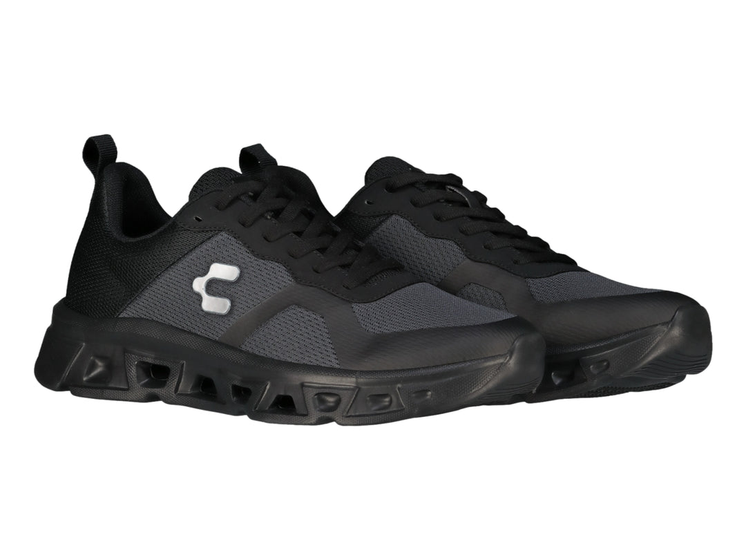 Tenis deportivos Charly Light Sport en color negro y gris con suela gruesa y tejido de malla.