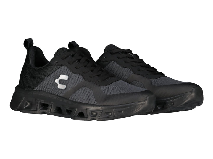 Tenis deportivos Charly Light Sport en color negro y gris con suela gruesa y tejido de malla.