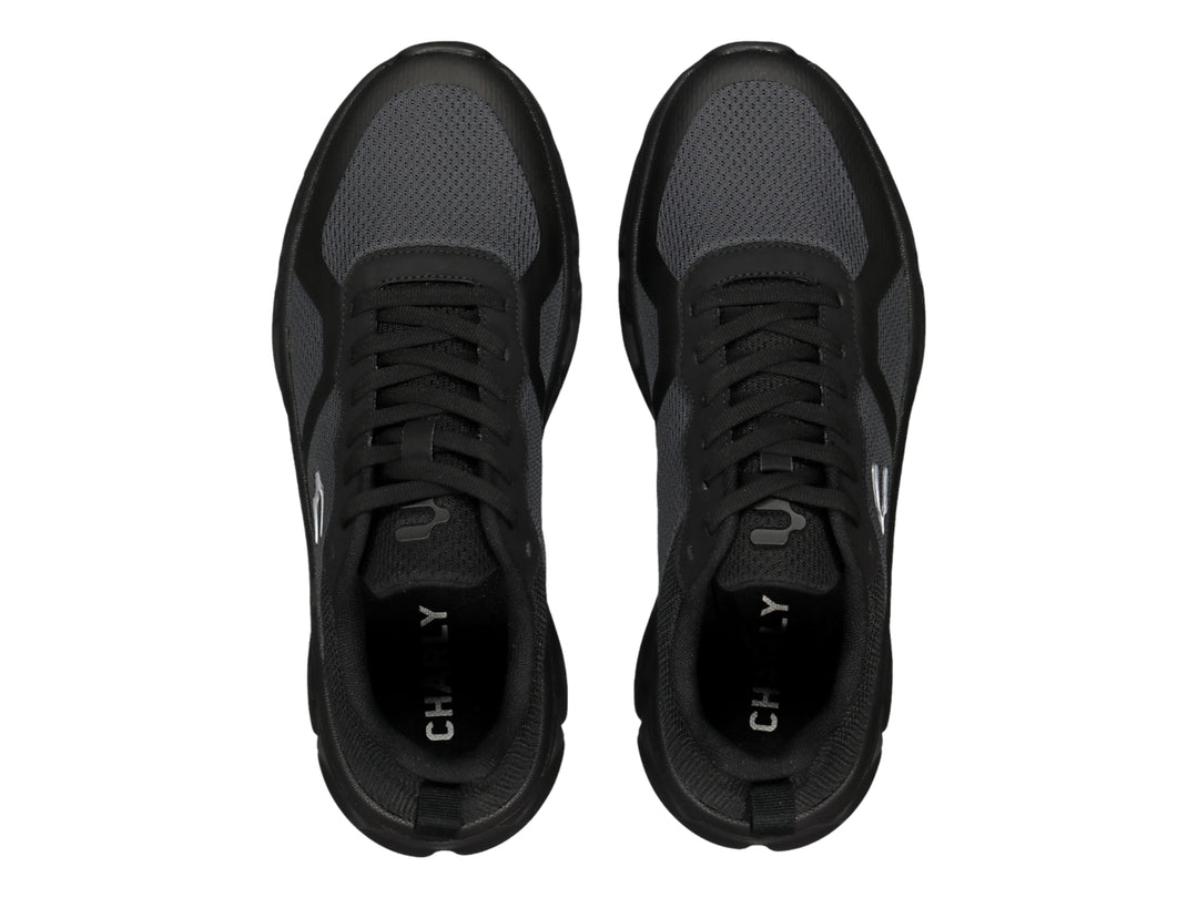 Tenis deportivos Charly Light Sport en color negro y gris con suela gruesa y tejido de malla.