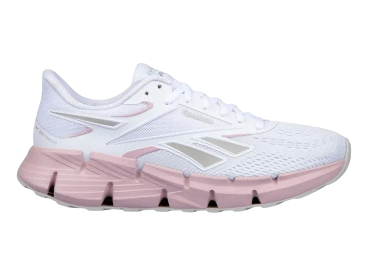 Tenis deportivos Reebok Zig Dynamica 6 en color blanco con suela rosa para mujer.
