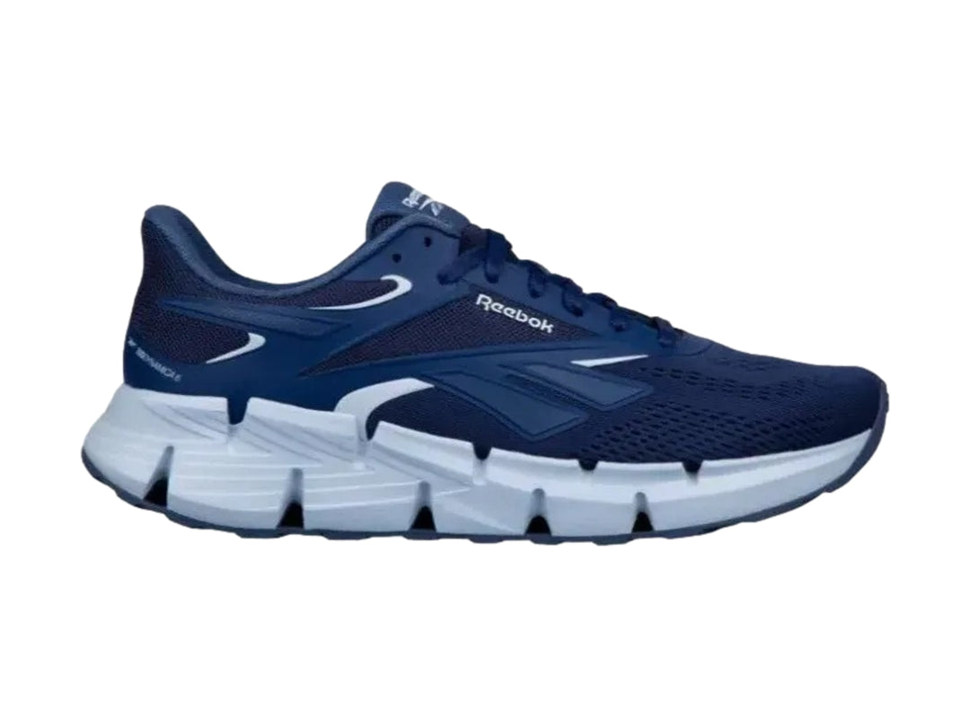 Tenis deportivos Reebok Zig Dynamica 6 en color azul con suela blanca.