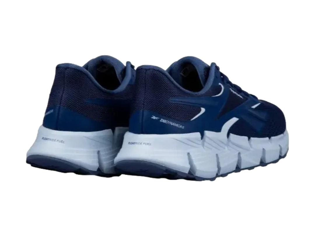 Tenis deportivos Reebok Zig Dynamica 6 en color azul con suela blanca.