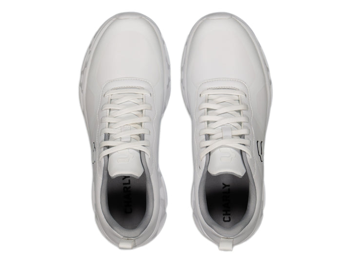 Tenis deportivos Charly Light Sport color blanco con detalles en gris y logo negro lateral.