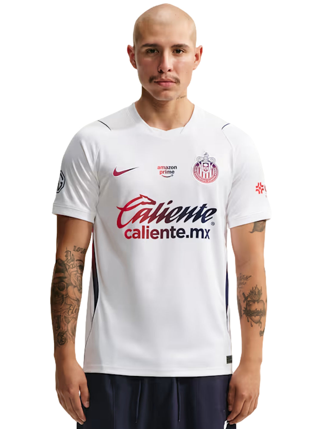 Jersey de fútbol Nike blanco de manga corta con detalles en azul y rojo.
