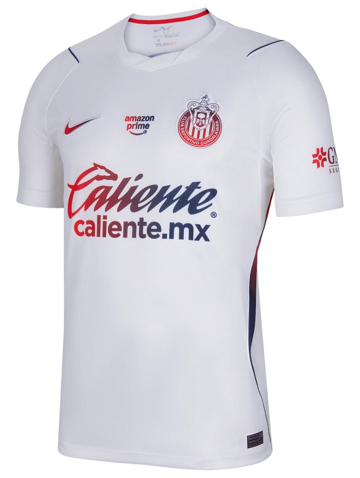 Jersey de fútbol Nike blanco de manga corta con detalles en azul y rojo.