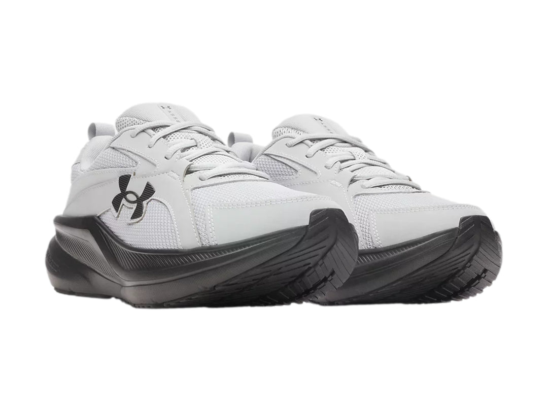 Tenis deportivos Under Armour Assert 11 color gris con suela gris oscuro.