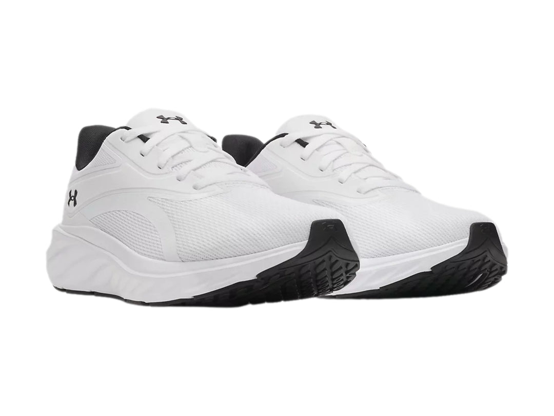 Tenis deportivos Under Armour Ascend en color blanco con detalles en negro.