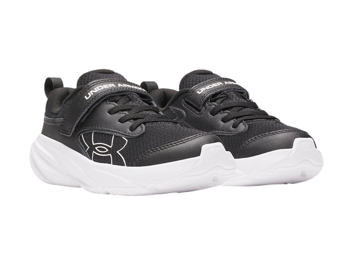 Tenis deportivos Under Armour en color negro con suela blanca y ajuste de correa velcro.