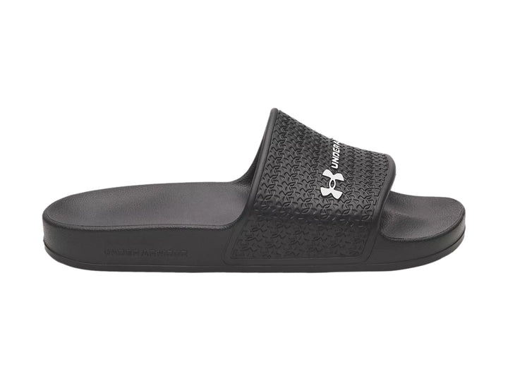 Sandalia Under Armour Slide Lite color negro con correa texturizada y logotipo blanco.