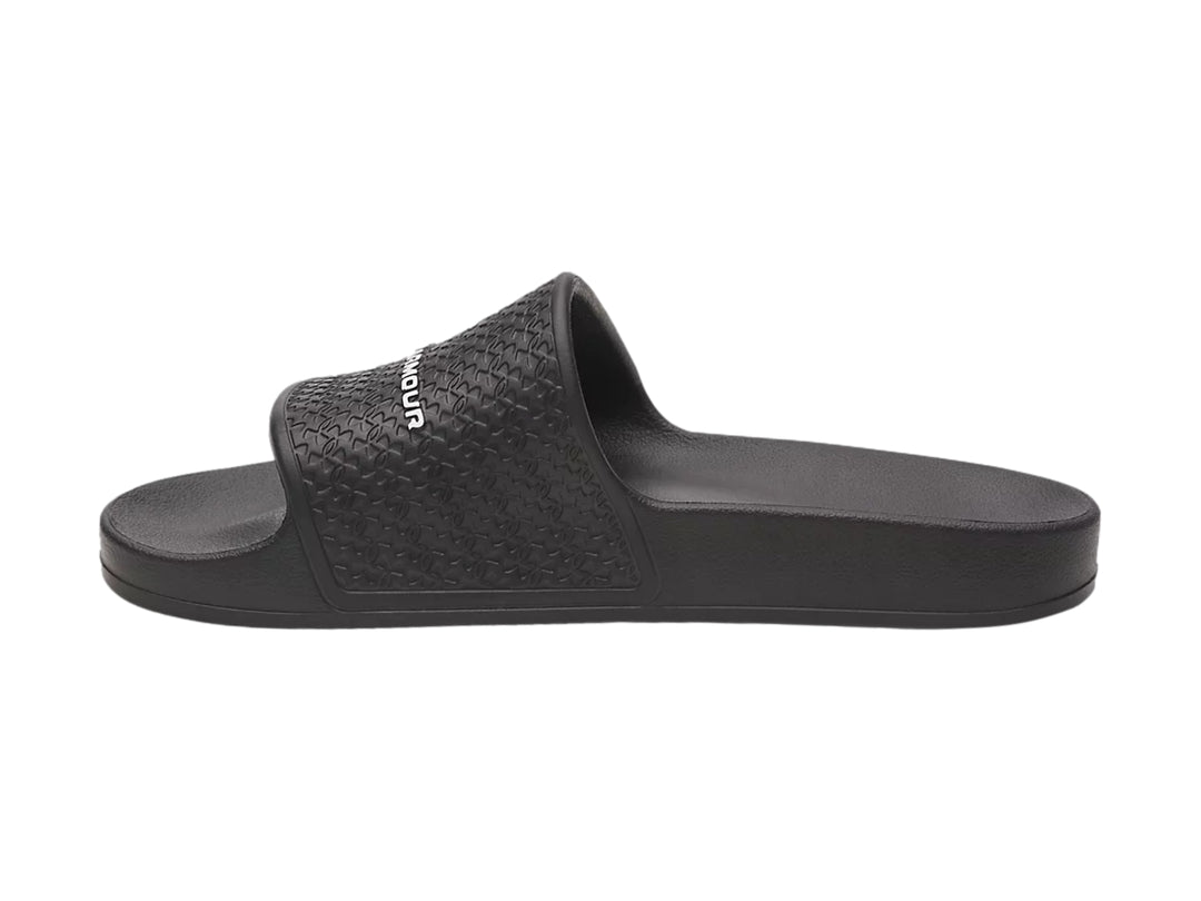 Sandalia Under Armour Slide Lite color negro con correa texturizada y logotipo blanco.