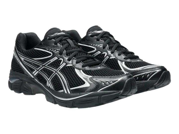 Tenis deportivos ASICS GT-2160 color negro con detalles en plata, vista lateral.