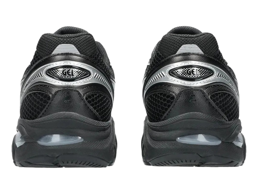 Tenis deportivos ASICS GT-2160 color negro con detalles en plata, vista lateral.