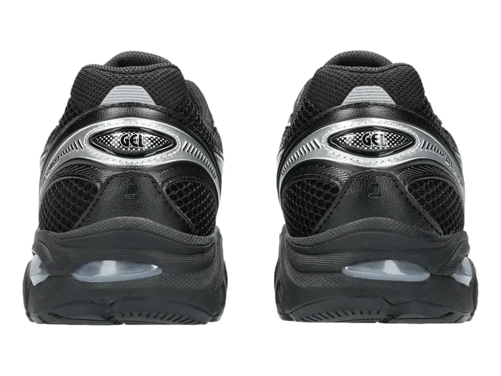 Tenis deportivos ASICS GT-2160 color negro con detalles en plata, vista lateral.