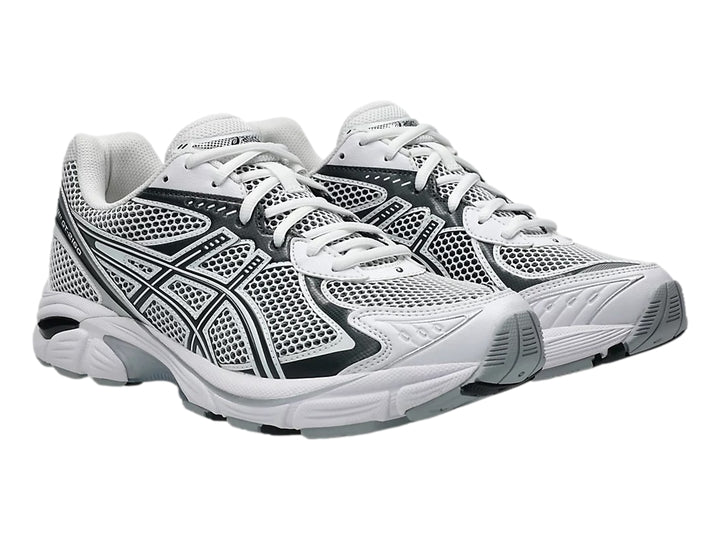 Tenis deportivos ASICS GT-2160 color blanco con detalles en gris grafito y malla transpirable.