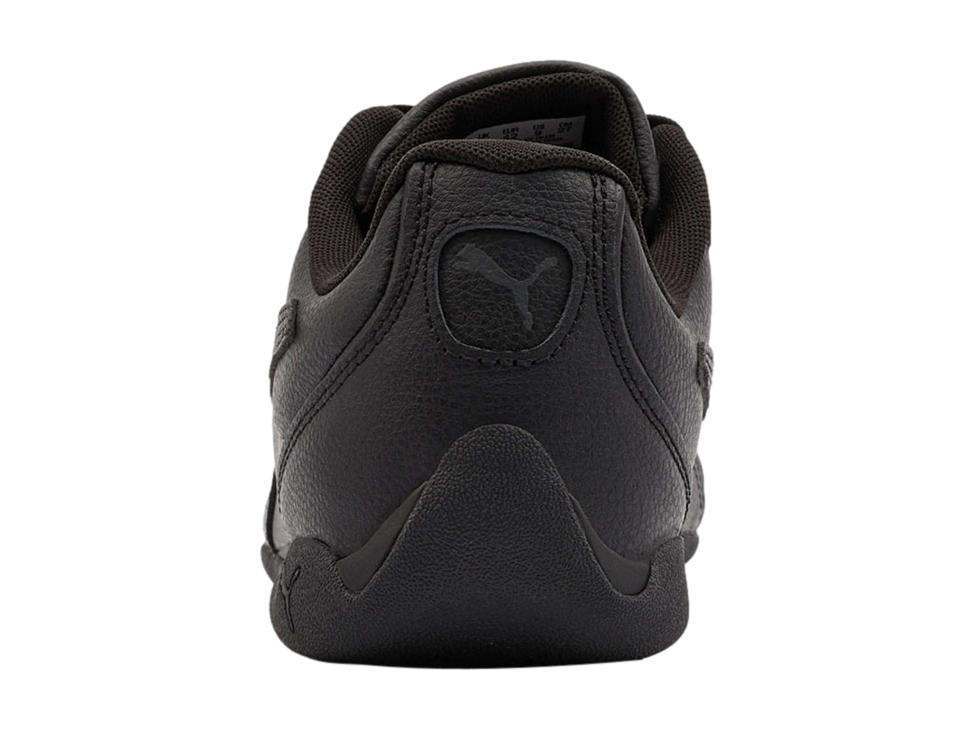 Tenis Puma Replicatch color negro, vista lateral, diseño deportivo de corte bajo.