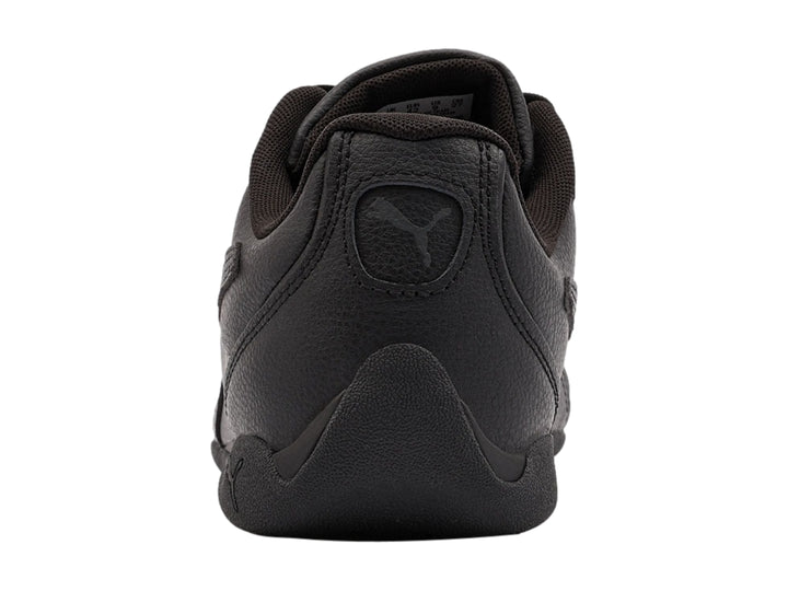 Tenis Puma Replicatch color negro, vista lateral, diseño deportivo de corte bajo.