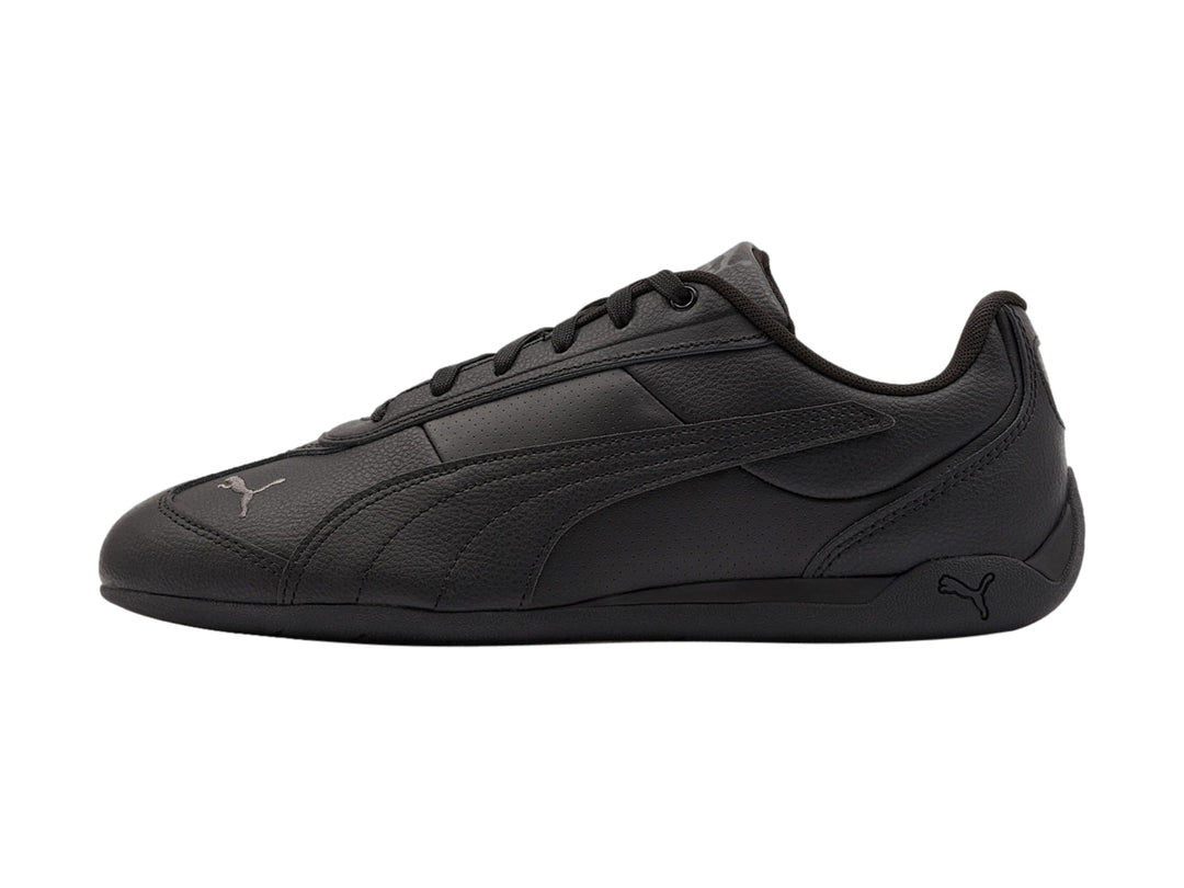 Tenis Puma Replicatch color negro, vista lateral, diseño deportivo de corte bajo.