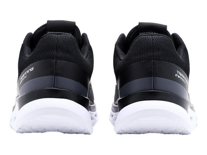 Tenis deportivos Pirma-Brasil color negro con suela blanca y tejido de malla.