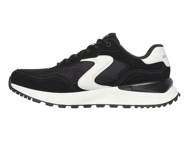 Tenis deportivos Skechers color negro con detalles y suela blanca.