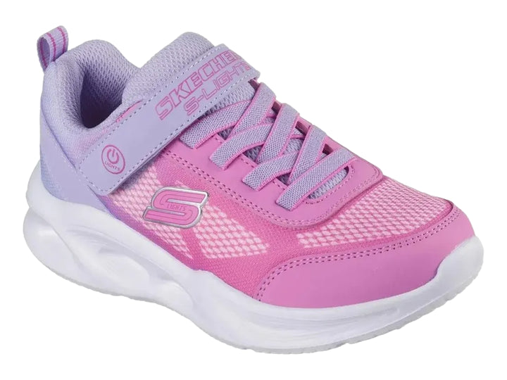Tenis Skechers deportivos en color rosa y lavanda con suela blanca y cierre de velcro.