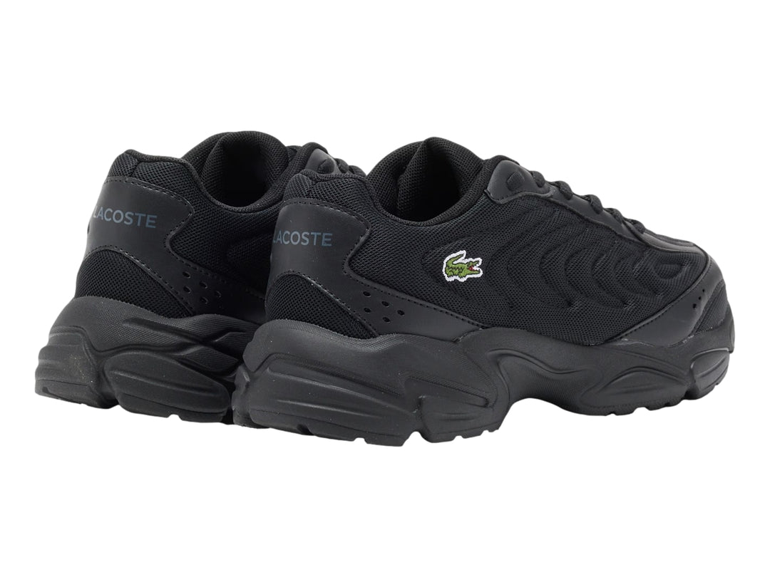 Tenis Lacoste Storm 96 2K Lite color negro para junior con suela gruesa y logo lateral.