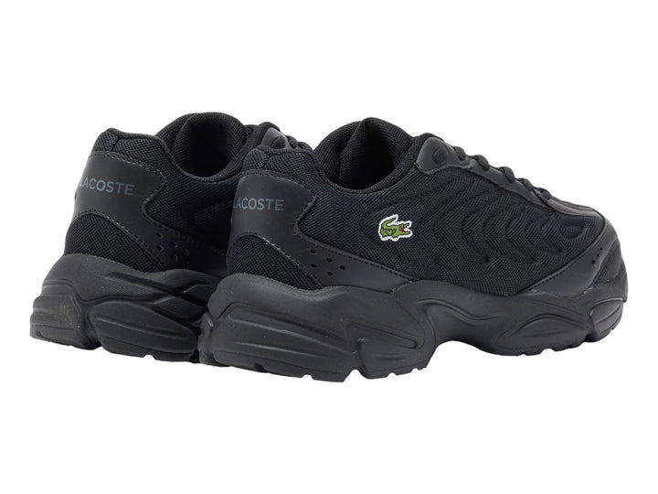 Tenis Lacoste Storm 96 2K Lite color negro para junior con suela gruesa y logo lateral.
