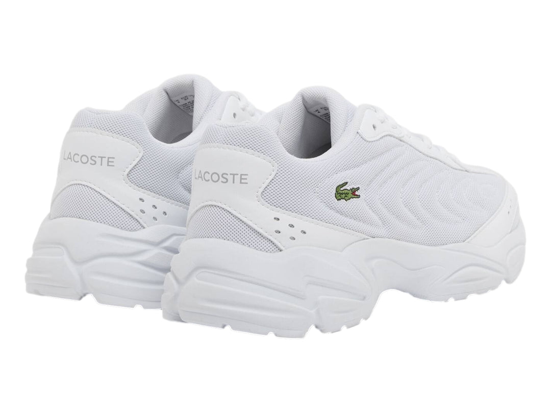 Tenis Lacoste Storm 96 2K Lite blancos para junior con suela gruesa y logo de cocodrilo verde.