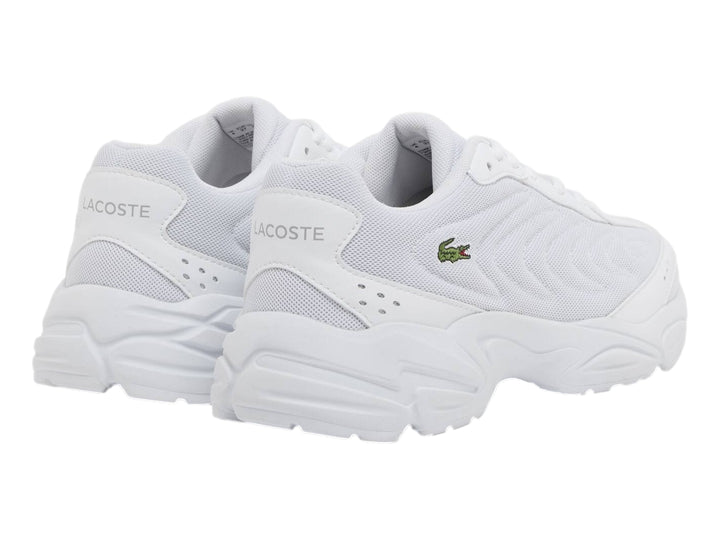Tenis Lacoste Storm 96 2K Lite blancos para junior con suela gruesa y logo de cocodrilo verde.