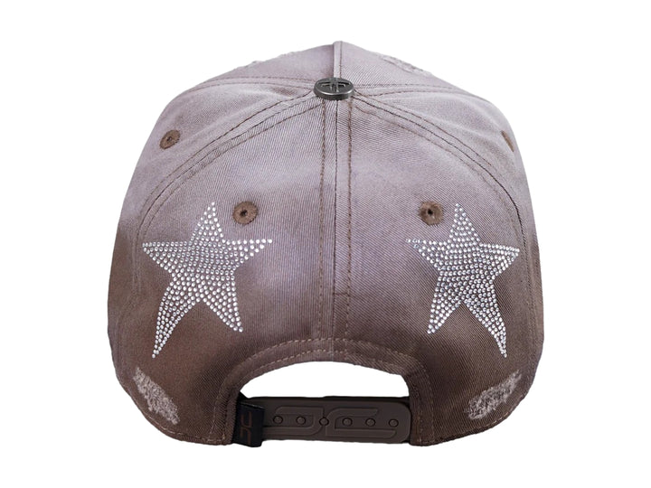 Gorra JC Hats color beige en tela denim con detalles de brillantes y efecto desgastado.