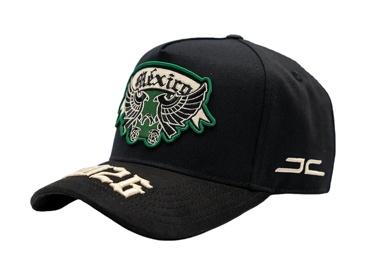 Gorra negra JC Hats con parche de México en verde y blanco y bordado 2026 en la visera.