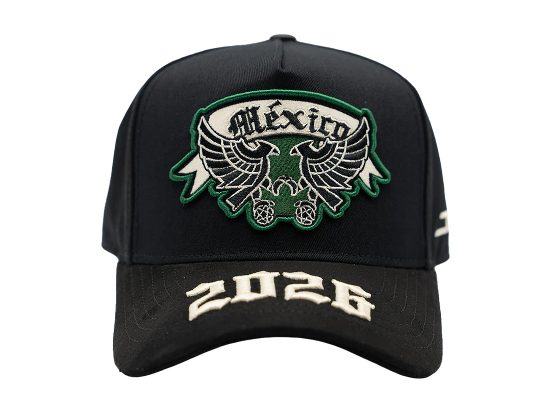 Gorra negra JC Hats con parche de México en verde y blanco y bordado 2026 en la visera.