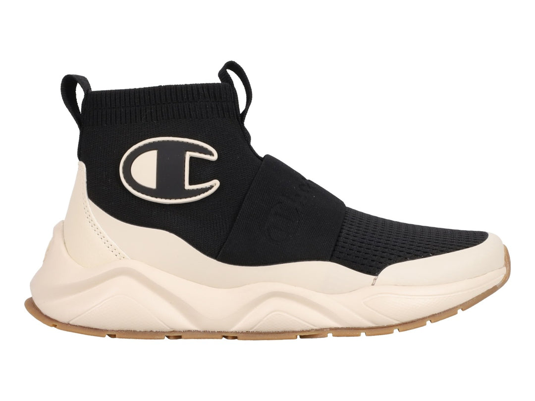 Tenis Champion Rally Pro MG en color negro y blanco con diseño tipo calcetín y suela gruesa color crema.