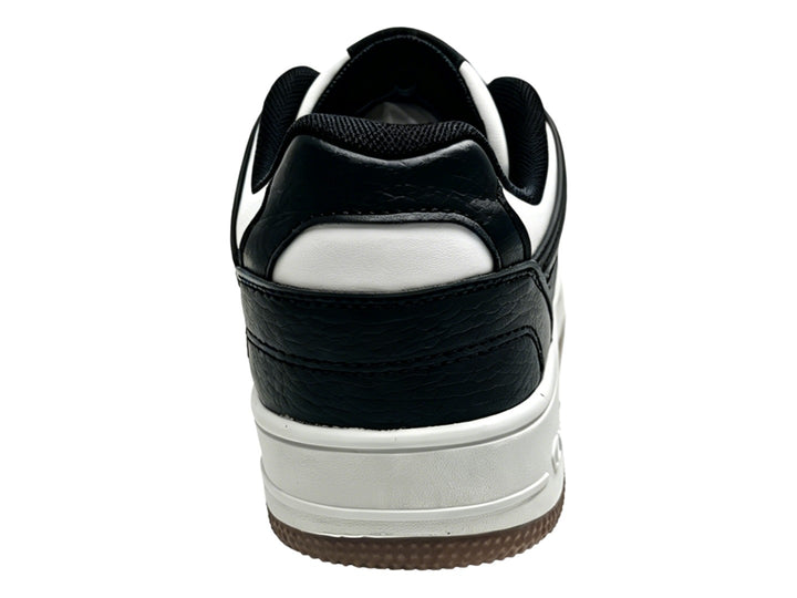 Tenis Champion Ace Cross en colores negro y blanco con suela blanca y detalle de correa velcro.