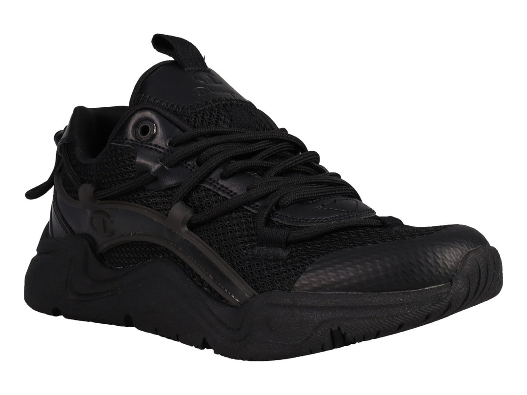 Tenis Champion Hyper C Pilot en color negro total para junior, con suela robusta y detalles en malla y sintético.