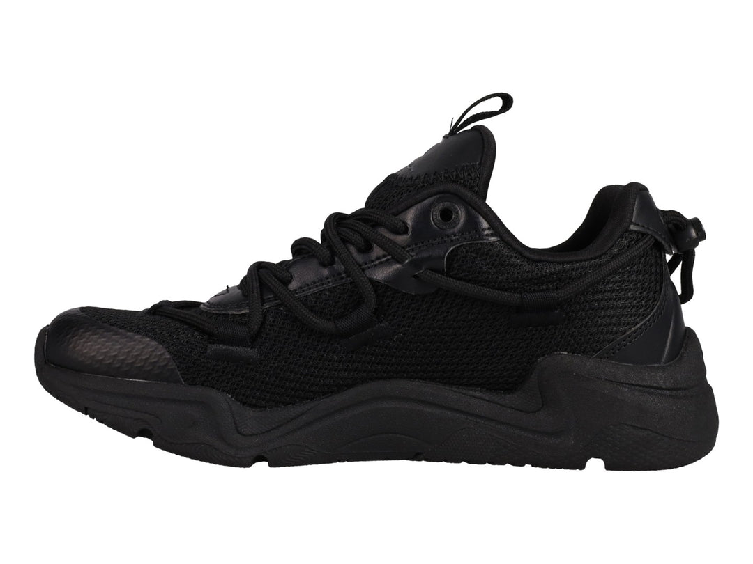 Tenis Champion Hyper C Pilot en color negro total para junior, con suela robusta y detalles en malla y sintético.
